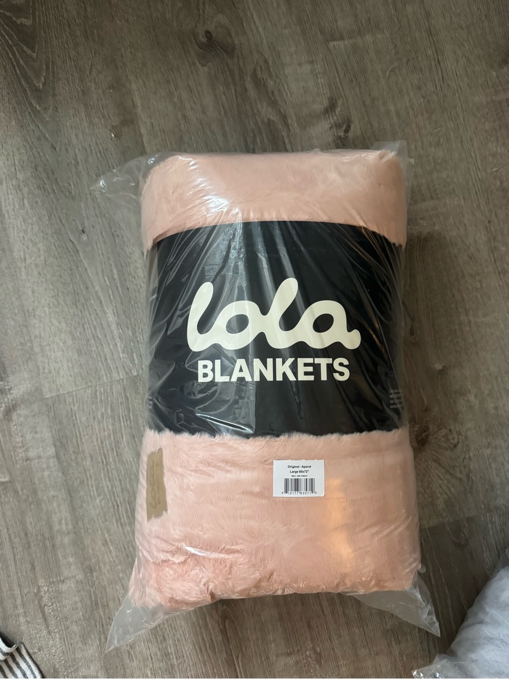 Brand new Lola blanket size large, color is “aperol” or blush pink.